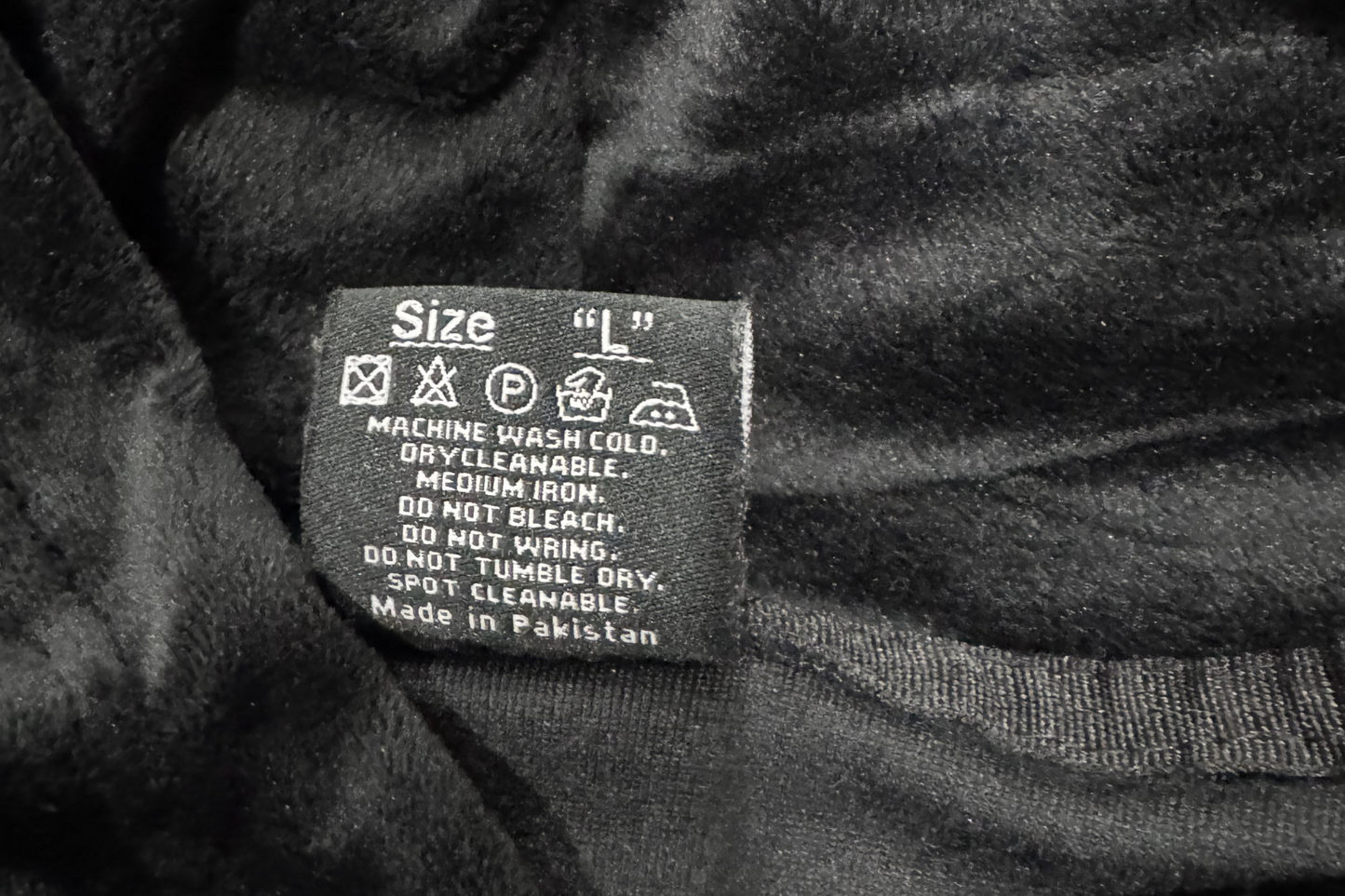 ONYR Clothing label on a dark fabric background